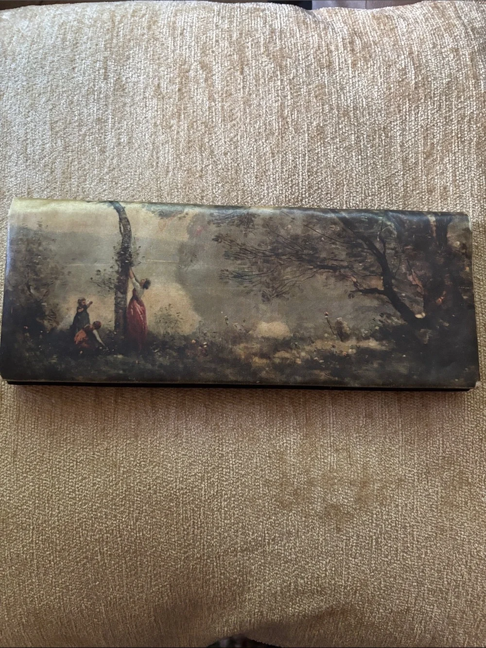Italian pastoral bifold wallet with fabric inlay.